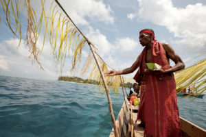 Traditional leaders from Kofiau Island, Raja Ampat, give offerings to the gods and goddesses of the ocean to guard the sea through a ritual called Kakes. Kakes was held after a ceremony where the Kofiau traditional elders gave a support letter to the Raja Ampat government declaring the zoning system for the Kofiau Marine Protected Area. Photo credit: ©2011 Nanang Sujana